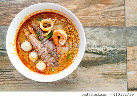 spicy seafood noodles bowl in Thai style spicy seafood noodles bowl in Thai style 110191759