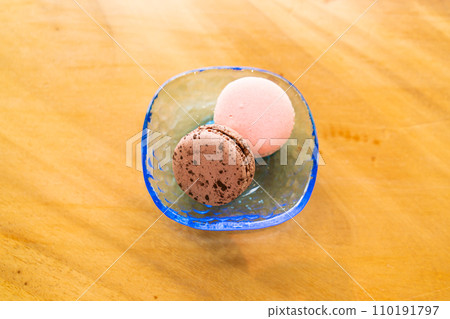 rose and chocolate macaron on plate rose and chocolate macaron on plate 110191797
