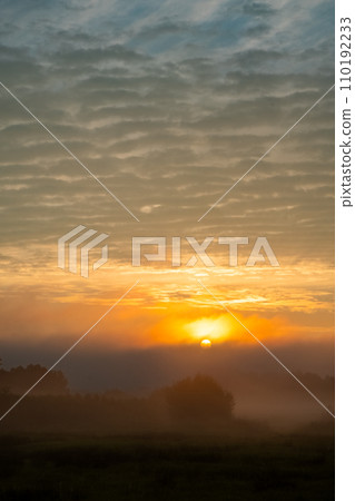Sunrise Embrace: Mist and Light Over Fields Sunrise Embrace: Mist and Light Over Fields 110192233
