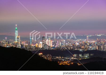 Stunning city skyline from dusk to illuminated. Taipei, Taiwan. Stunning city skyline from dusk to illuminated. Taipei, Taiwan. 110194419