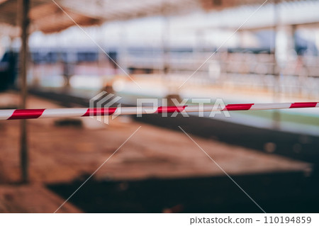red and white tape with blurred background 110194859