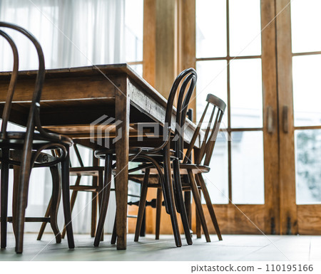 large wooden table and chairs 110195166