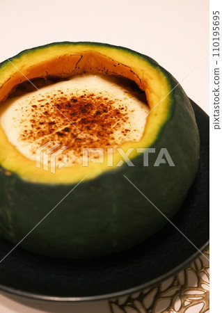 pumpkin on a black plate pumpkin on a black plate 110195695