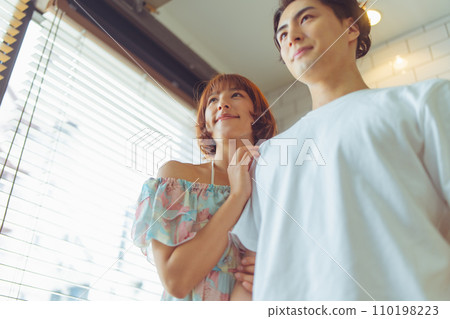 Portrait of a man and woman cuddling Portrait of a man and woman cuddling 110198223