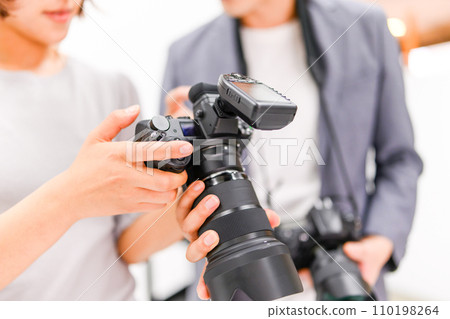 Shooting in a studio with a photographer 110198264