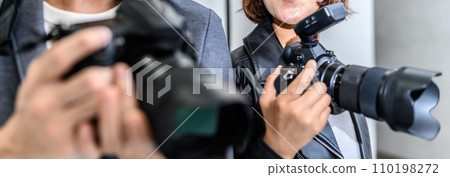 two cameramen 110198272