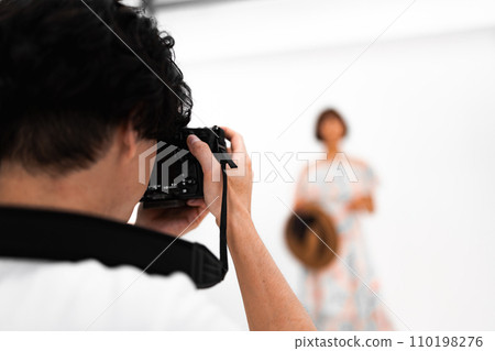 Shooting in a studio with a photographer 110198276