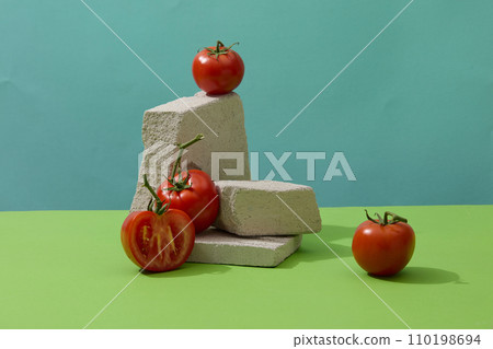Red tomatoes and some blocks of stones displayed for healthy concept. Tomato is abundant in anti-inflammatory compounds such as vitamins C and E 110198694