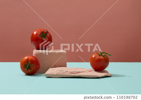 Front view of natural tomatoes placed on stone podium. Tomato (Solanum lycopersicum) contains several skin-benefiting vitamins Front view of natural tomatoes placed on stone podium. Tomato (Solanum lycopersicum) contains several skin-benefiting vitamins 110198702