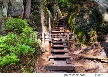 View of a wooden staircase in the mountains. Hiking. View of a wooden staircase in the mountains. Hiking. 110198759