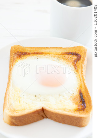 Morning toast with delicious fried egg and hot coffee Morning toast with delicious fried egg and hot coffee 110201408