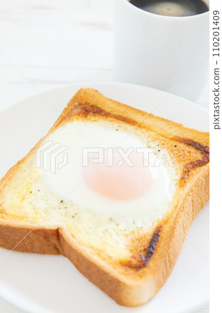 Morning toast with delicious fried egg and hot coffee Morning toast with delicious fried egg and hot coffee 110201409