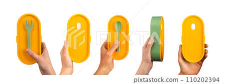 Hands holding lunchboxes and spoon, fork. Lunch box, food container, case isolated on white Hands holding lunchboxes and spoon, fork. Lunch box, food container, case isolated on white 110202394