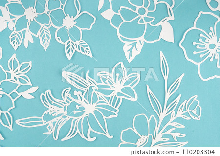 White paper cut plants leaves on blue background White paper cut plants leaves on blue background 110203304