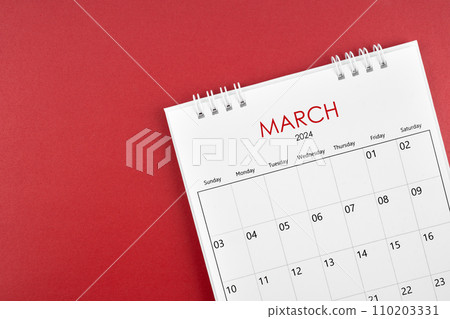 March 2024 desk calendar on red background. March 2024 desk calendar on red background. 110203331