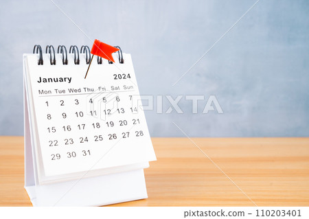 January 2024 calendar and red push pin. January 2024 calendar and red push pin. 110203401