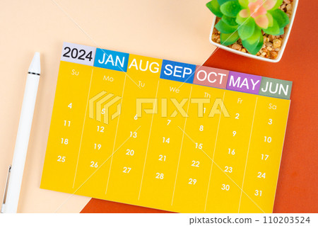 August 2024 calendar page with pen. 110203524
