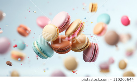 Various colorful macarons float in the air on the isolated background 110203644