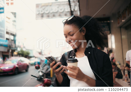 Asian woman enjoy travel in  downtown district 110204473