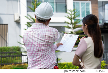 Senior home inspector explains Inspection results with homeowner, handyman holding clipboard and after checking details before renovations home, house improvement interior, Interior design Real estate 110204562