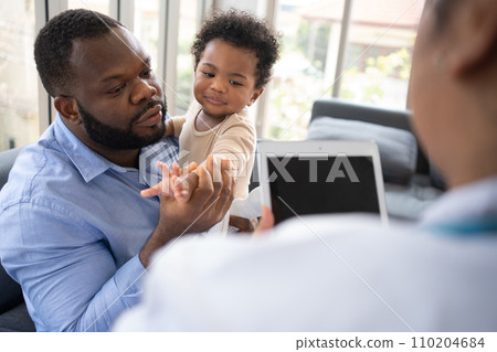 Pediatrics doctor with stethoscope for lungs or chest checkup for examining cute little girl in medical healthcare hospital or clinic. Doctor check Heart And Lungs for Smiling African American Baby. Pediatrics doctor with stethoscope for lungs or chest checkup for examining cute little girl in medical healthcare hospital or clinic. Doctor check Heart And Lungs for Smiling African American Baby. 110204684