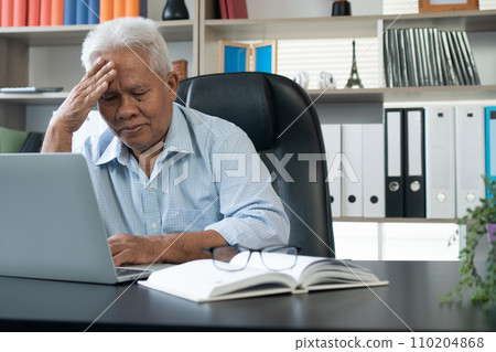 Happy senior Asian using the laptop for calculating and make a note of daily expenses. Concept of lifestyle, learning, and finance business 110204868