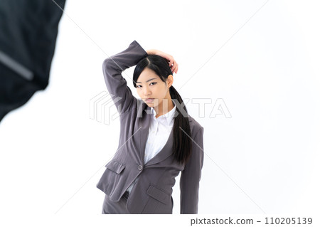 fashion model standing in front of lighting fashion model standing in front of lighting 110205139