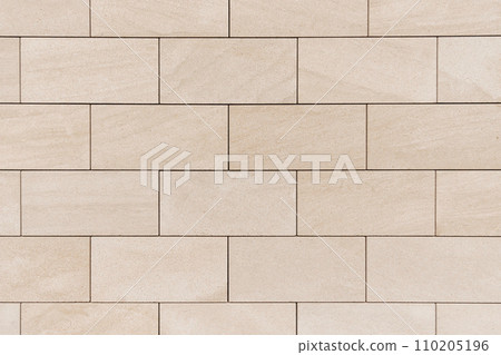 brick wall made of light beige bricks. fresh brickwork, house decoration brick wall made of light beige bricks. fresh brickwork, house decoration 110205196