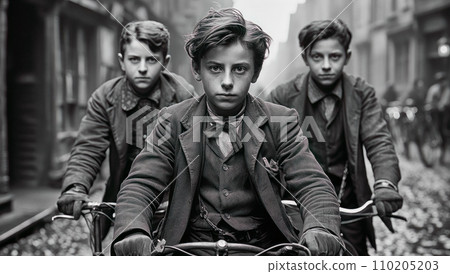 Old black and white photo of Old Amsterdam, boys riding bicycles down the street. Nostalgic scenes, industrial city scenes, working class scenes. 110205203