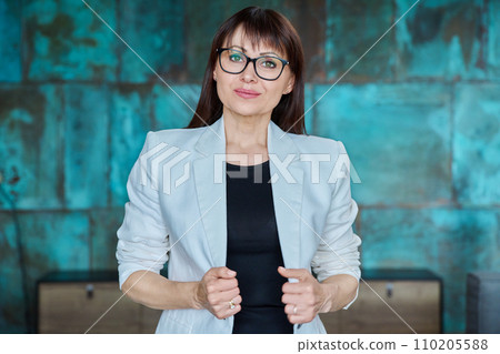 Portrait of business elegant middle-aged woman in office 110205588