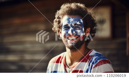 Smiling, sexy man with his face painted in the color of the flag of the United States of America. 110206019