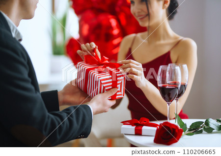 Valentine's Day concept. A loving couple celebrating Valentine's Day in the restaurant. 110206665