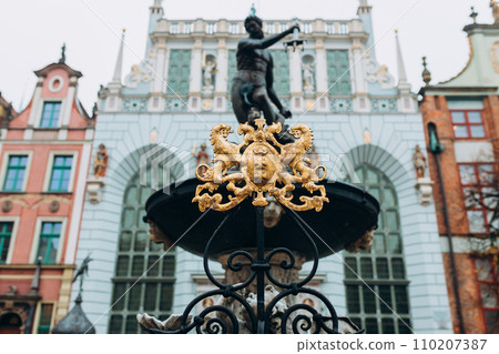 Emblem of the city Gdansk. Beautiful old houses historical part of downtown, Neptune fountain, Vacation concept Emblem of the city Gdansk. Beautiful old houses historical part of downtown, Neptune fountain, Vacation concept 110207387