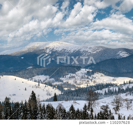 Small alpine village and winter snowy mountains, Voronenko, Carpathian, Ukraine. Small alpine village and winter snowy mountains, Voronenko, Carpathian, Ukraine. 110207628