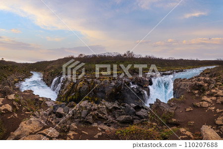Picturesque waterfall Hlauptungufoss autumn view. Season changing in southern Highlands of Iceland. Picturesque waterfall Hlauptungufoss autumn view. Season changing in southern Highlands of Iceland. 110207688