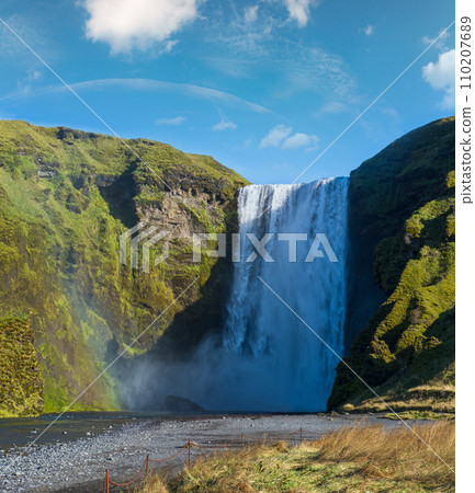 Picturesque full of water big waterfall Skogafoss autumn view, southwest Iceland. 110207689