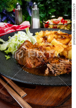 Stewed pork neck in sauce. 110208229