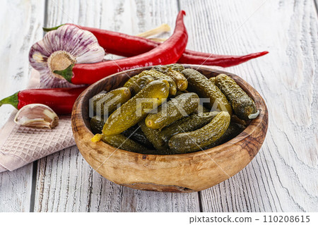Marinated small cucumbers in the bowl Marinated small cucumbers in the bowl 110208615