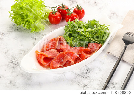Sliced salmon with fresh arugula Sliced salmon with fresh arugula 110208800