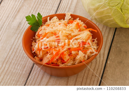 Sauerkraut - pickled cabbage in the bowl Sauerkraut - pickled cabbage in the bowl 110208833
