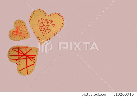 Eco friendly zero waste simple craft. Season home valentines day decor on pink background. Eco friendly zero waste simple craft. Season home valentines day decor on pink background. 110209310