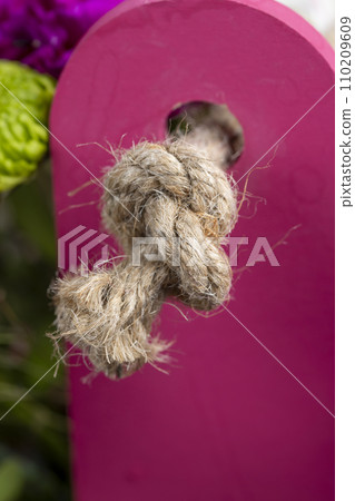 rough rope on a wooden table 110209609