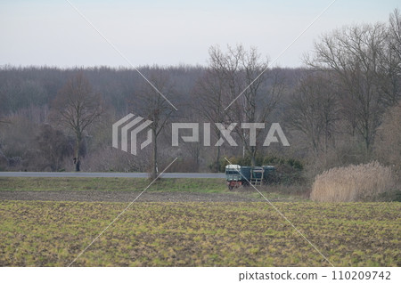Agricultural trailer in a field near Meerbusch, Germany Agricultural trailer in a field near Meerbusch, Germany 110209742