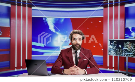 Media journalist talks about news segment on live television, addressing everyday important topics for advertisement. Man reporter presenting breaking news on tv program, doing newscast. 110210769