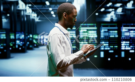 Repairman doing annual checkup in blockchain technology application specific integrated circuit supercomputer establishment. System administrator doing technical investigations in mining farm Repairman doing annual checkup in blockchain technology application specific integrated circuit supercomputer establishment. System administrator doing technical investigations in mining farm 110210806