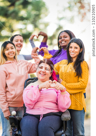 Inspire Inclusion international womens day. Diverse group do heart love with hands. Disability  110210905