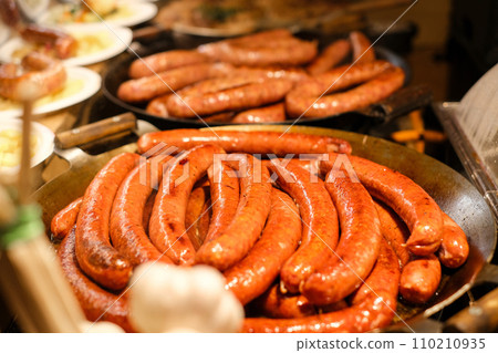 A group of sausages on a table on the fair 110210935