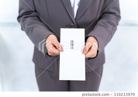 Career woman submitting resignation letter Career woman submitting resignation letter 110213970