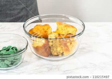 Measured ingredients in glass mixing bowls to make cactus cake pops for the Cinco de Mayo celebration. 110215497