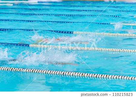 child swimmer swim in swimming pool. Water sports and competition, learning to swim classes for children. child swimmer swim in swimming pool. Water sports and competition, learning to swim classes for children. 110215823